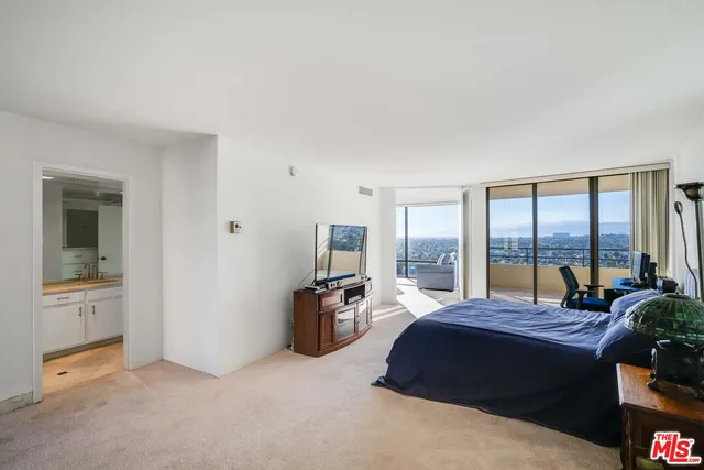 a room with lots of chairs and mirrors