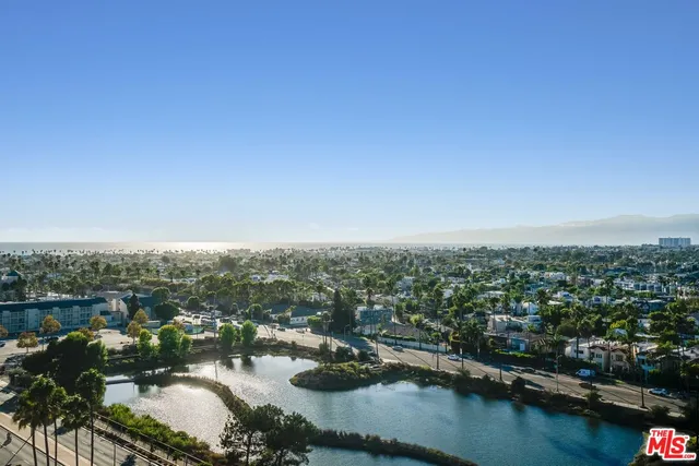 a view of a swimming pool with chairs