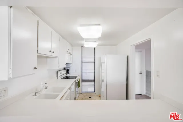 a view of a swimming pool with sitting area