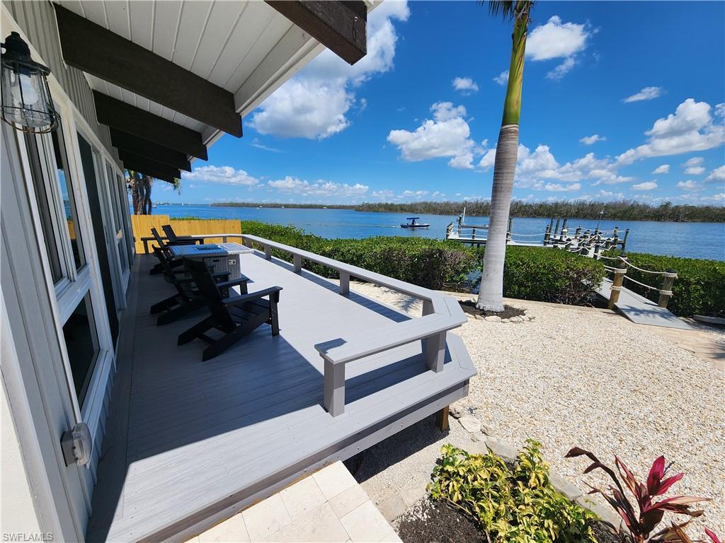 21521 Madera Road Fort Myers Beach, FL 33931 - Photo 11 of 45 a view of deck with a flat tv screen and a bench