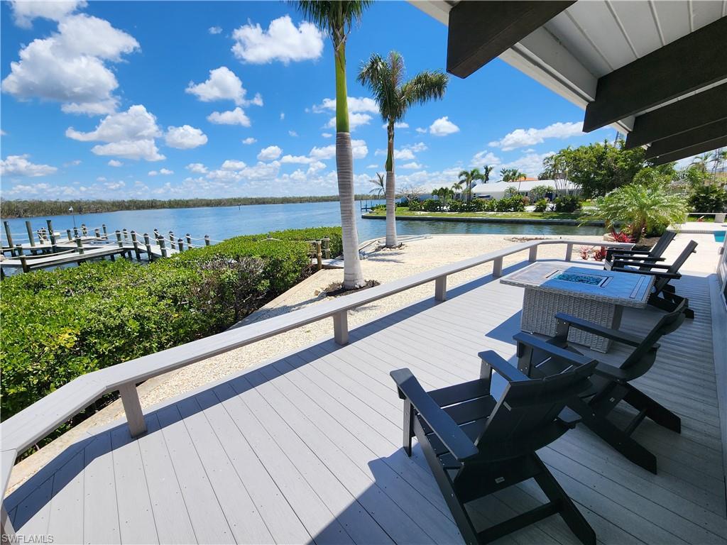 21521 Madera Road Fort Myers Beach, FL 33931 - Photo 13 of 45 a view of a chairs and table on the terrace