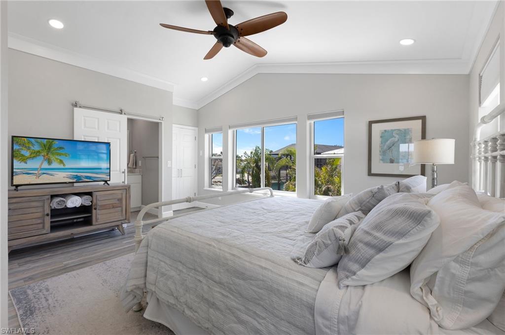 21521 Madera Road Fort Myers Beach, FL 33931 - Photo 32 of 45 a bedroom with a bed and a television