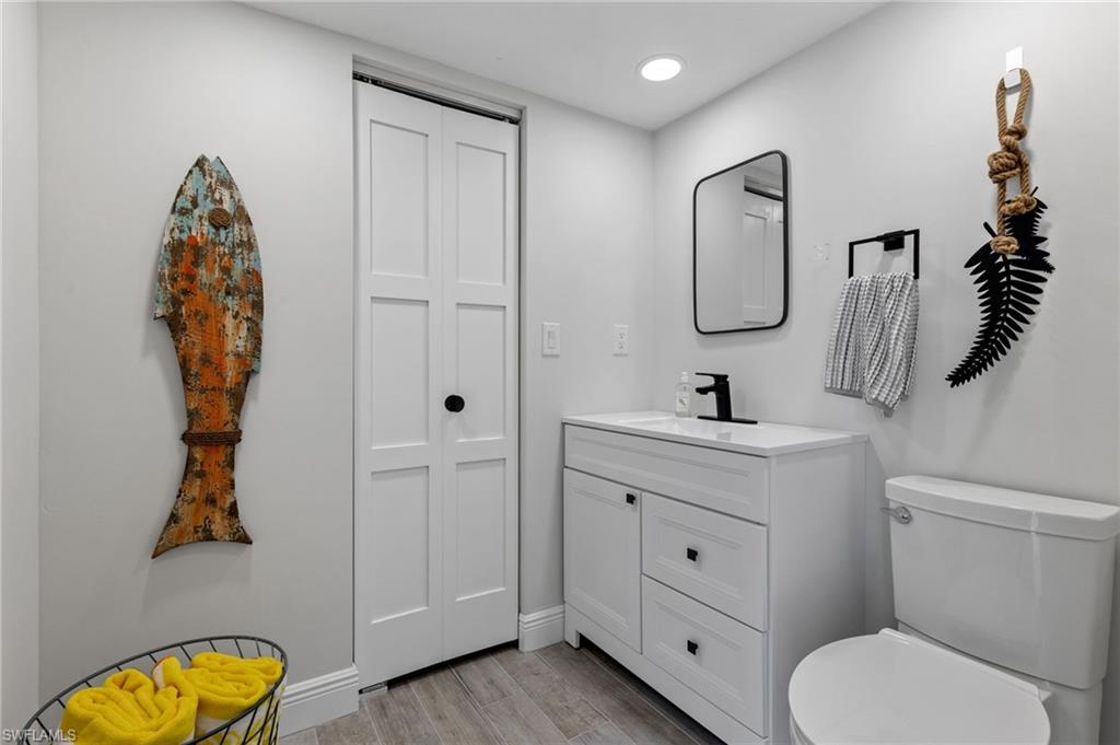 21521 Madera Road Fort Myers Beach, FL 33931 - Photo 40 of 45 a bathroom with a sink a toilet and shower