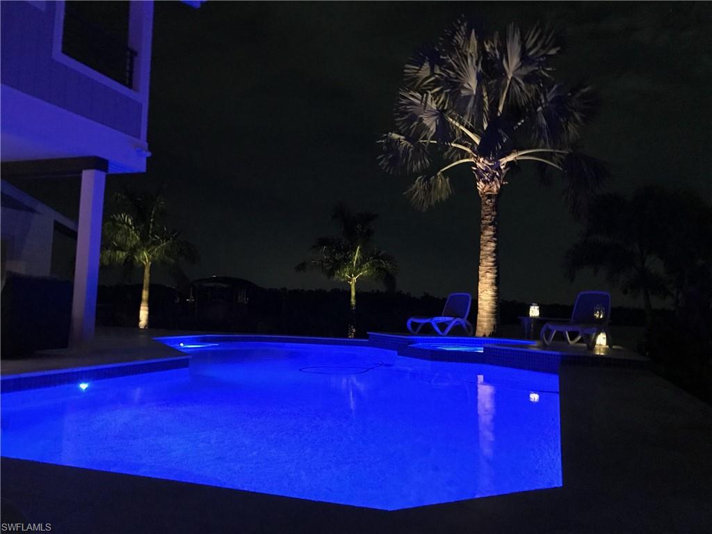 21521 Madera Road Fort Myers Beach, FL 33931 - Photo 7 of 45 a view of swimming pool with outdoor seating