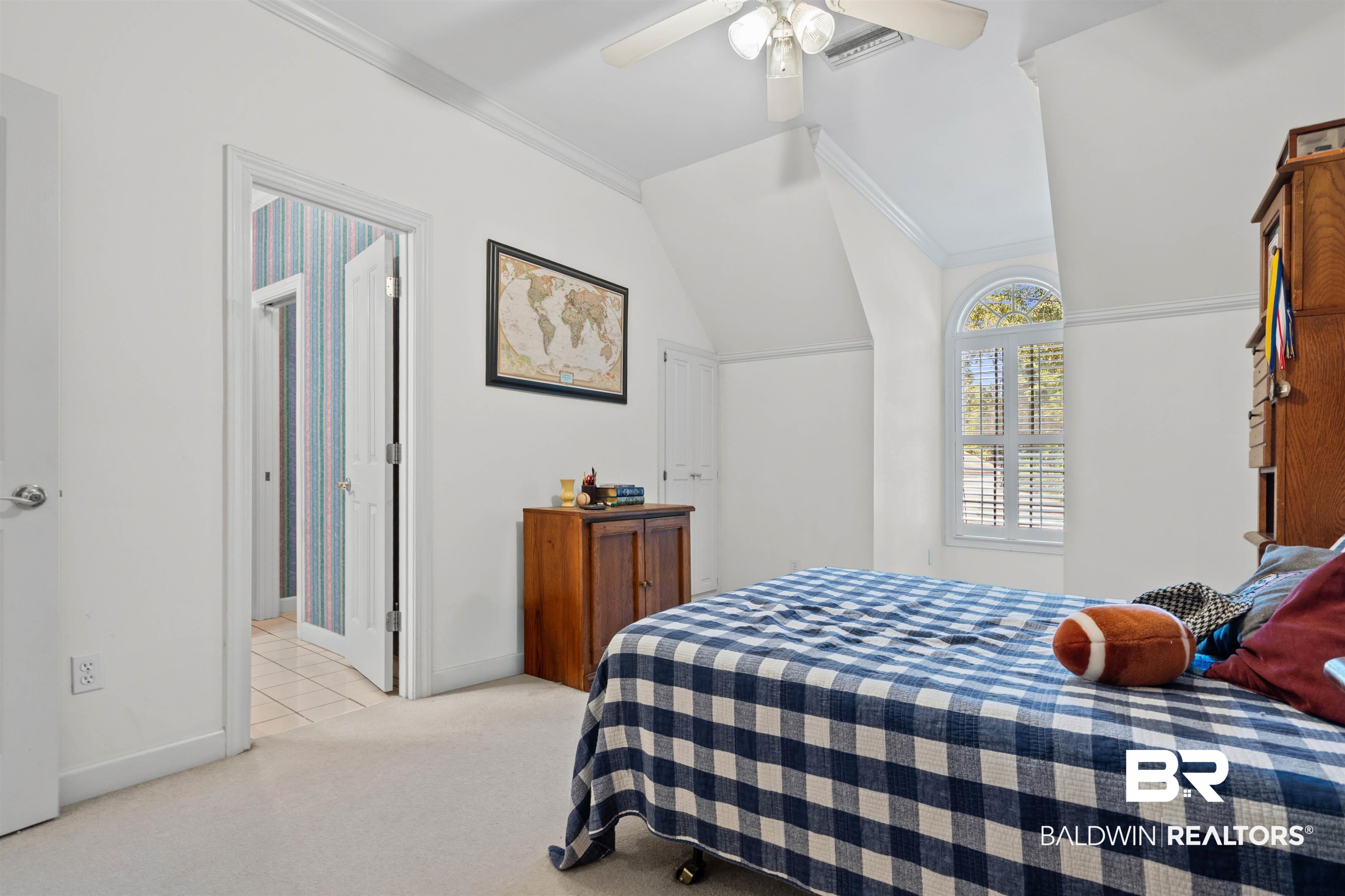 107 Beaver Dam Road Fairhope, AL 36532 - Photo 23 of 45 Bedroom featuring crown molding, vaulted ceiling, light colored carpet, and ceiling fan