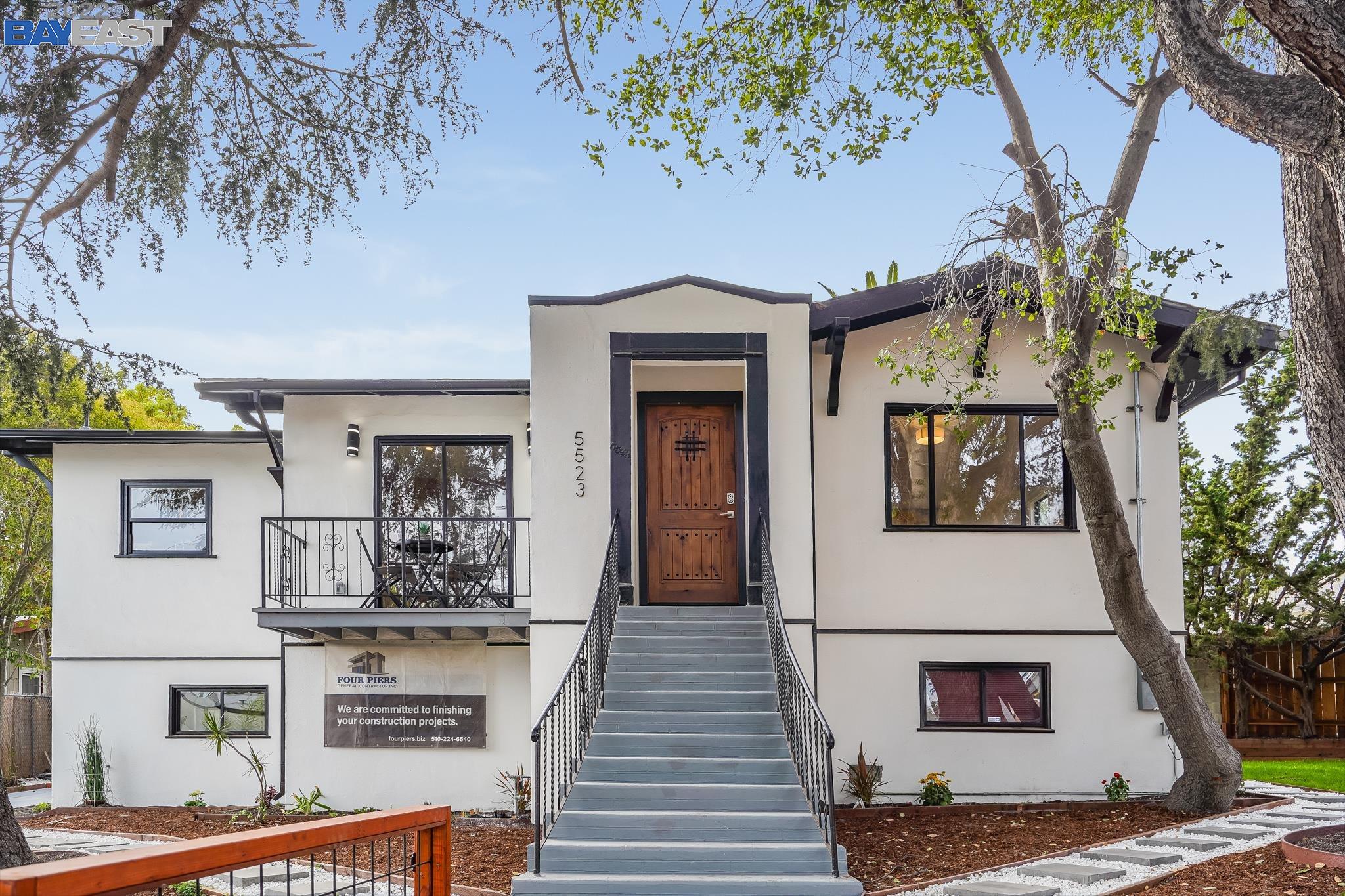 5523 Fleming Avenue Oakland, CA 94605 - Photo 1 of 1 a front view of a house with a tree