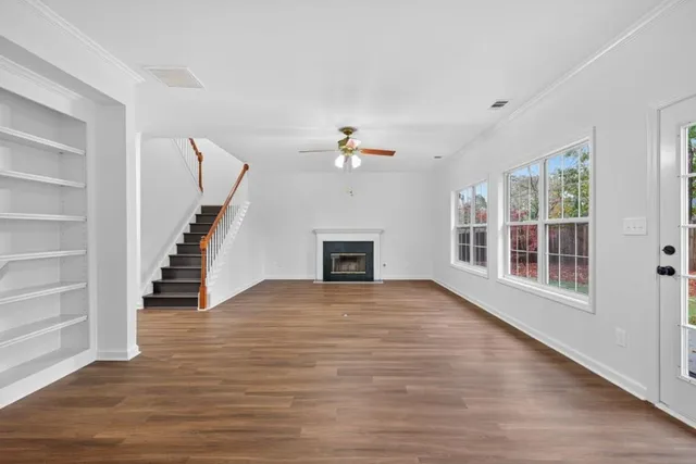 a view of an entryway with wooden floor