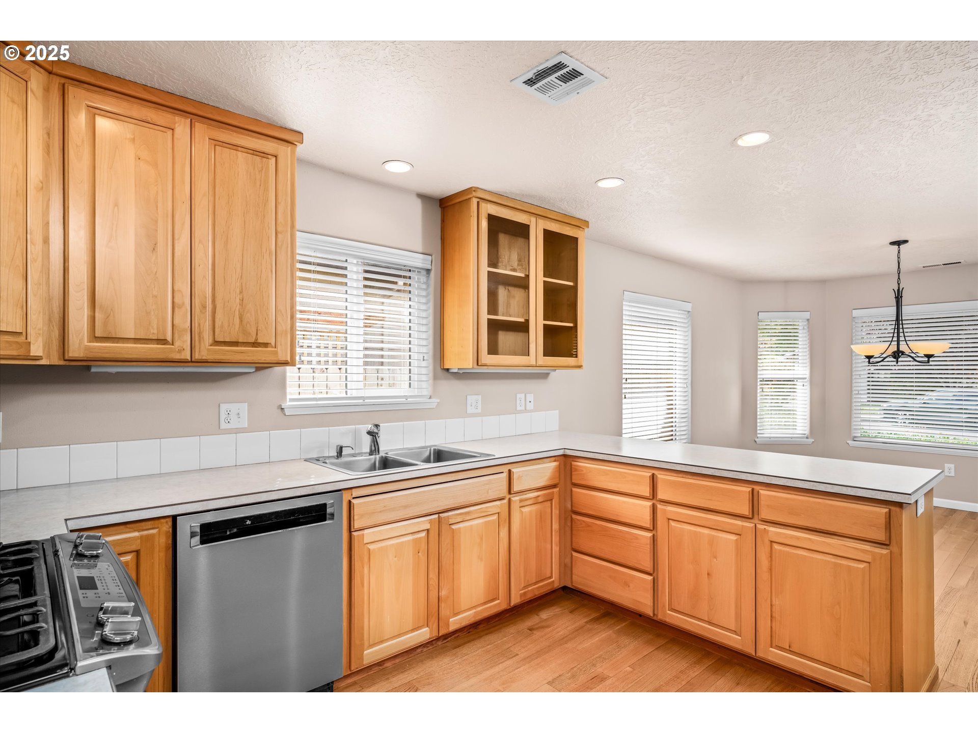 1176 Unity Drive Junction City, OR 97448 - Photo 9 of 44 a kitchen with a sink window and cabinets