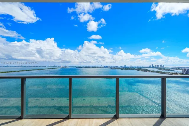 a view of balcony with wooden floor