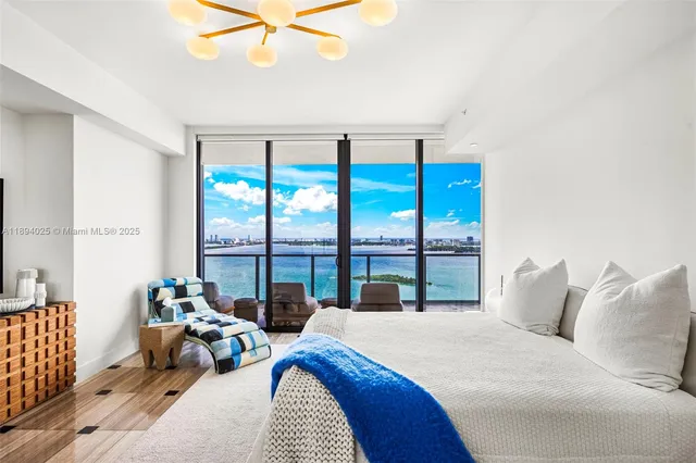 a en suite bathroom with a granite countertop sink and a mirror