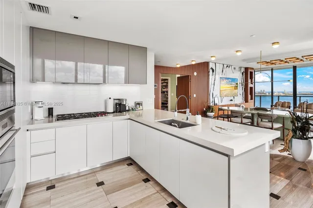 a view of an entryway with wooden floor and door
