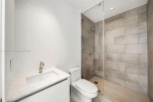 a view of a living room with a flat screen tv