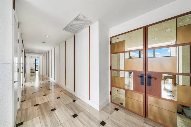 a bathroom with a granite countertop sink a toilet and a shower