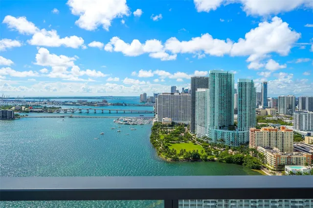 a very nice looking room with a large window and wooden floor