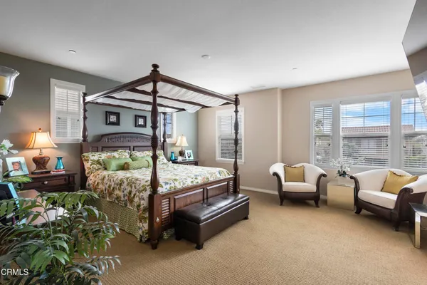 a bedroom with bed and window
