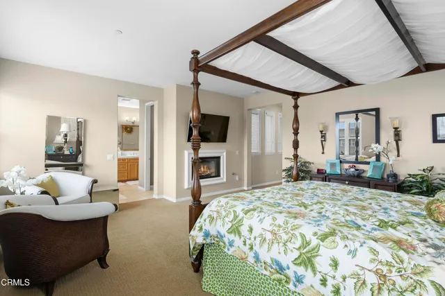 a bedroom with a bed window and couch