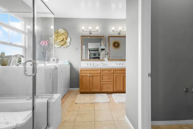 a bathroom with a sink a vanity and mirror