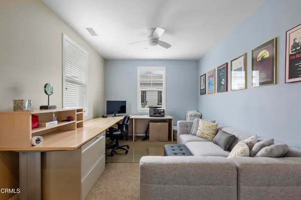 a living room with furniture and a window