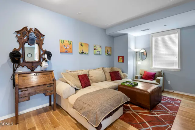 a living room with furniture and a rug