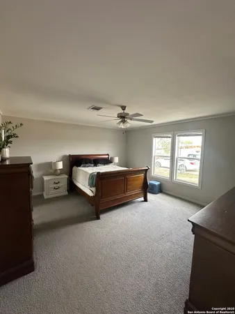 a view of a livingroom with furniture and a window