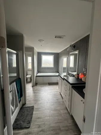 a kitchen with granite countertop a stove and a refrigerator