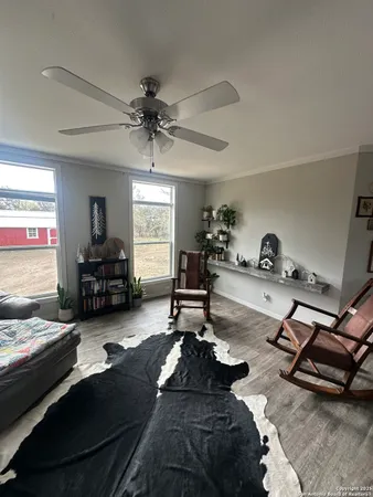 a living room with furniture gym equipment and view of living room