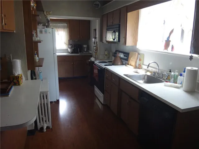 a kitchen with sink cabinets and window