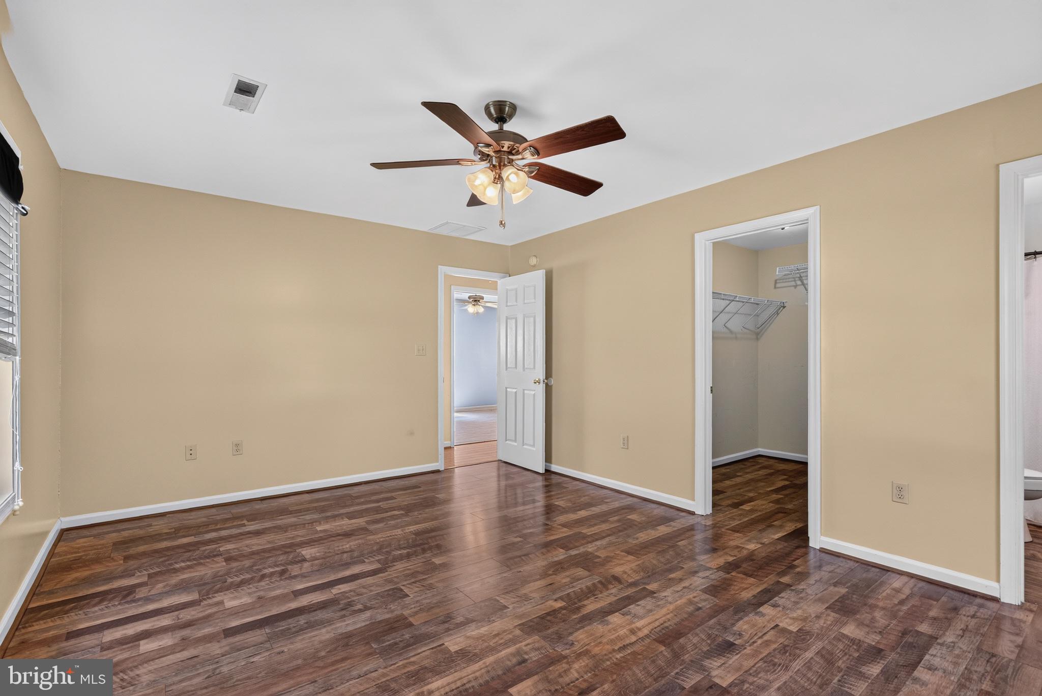 5716 Bethlehem Road Preston, MD 21655 - Photo 20 of 37 Spacious room with warm tones.