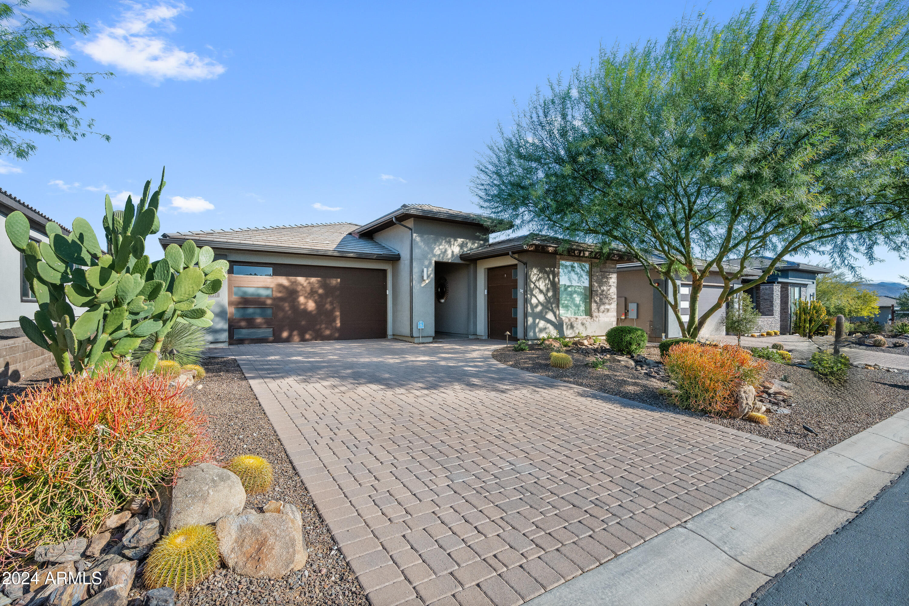 17910 East Cindercone Road Rio Verde, AZ 85263 - Photo 1 of 38 a front view of a house with a yard and garage