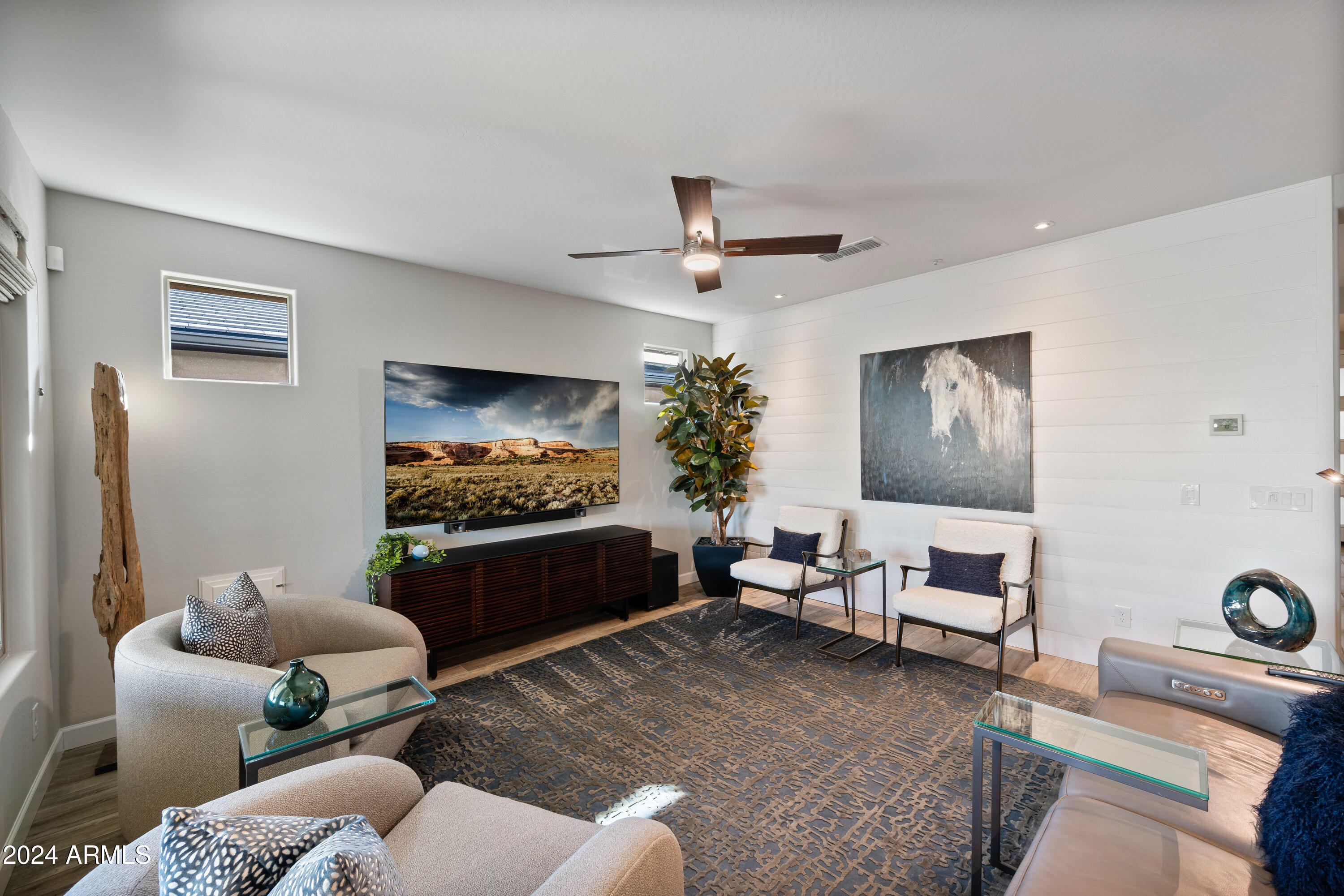 17910 East Cindercone Road Rio Verde, AZ 85263 - Photo 16 of 38 a living room with furniture and a flat screen tv