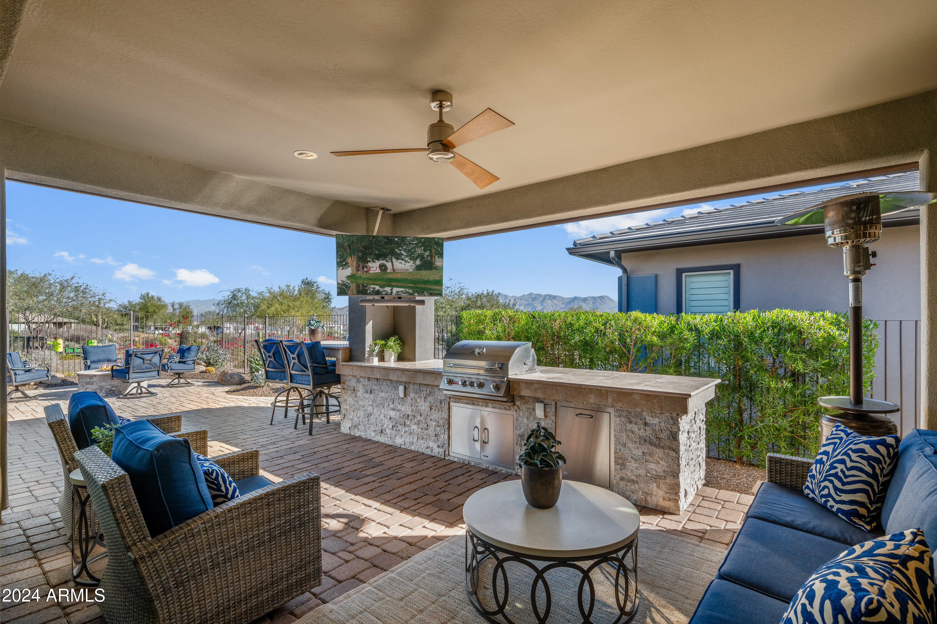 17910 East Cindercone Road Rio Verde, AZ 85263 - Photo 19 of 38 a outdoor space with patio the couches and a potted plant