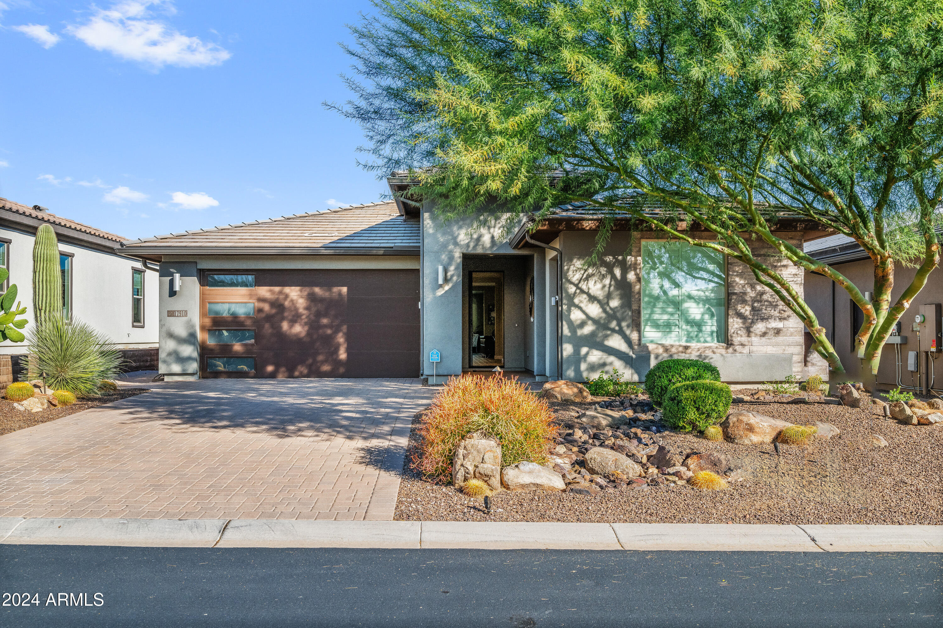 17910 East Cindercone Road Rio Verde, AZ 85263 - Photo 2 of 38 a front view of a house with garden