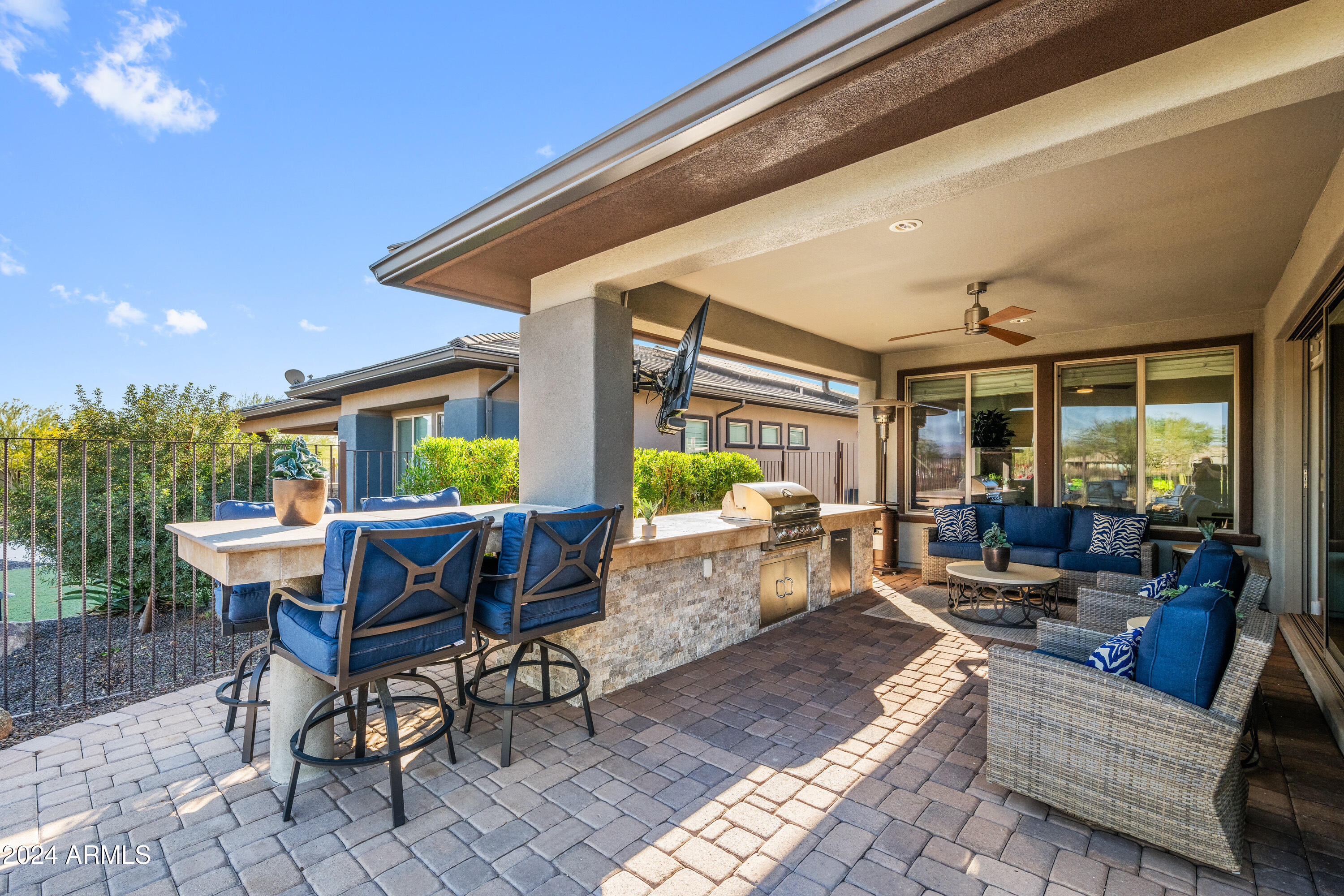 17910 East Cindercone Road Rio Verde, AZ 85263 - Photo 21 of 38 a patio with patio table and chairs