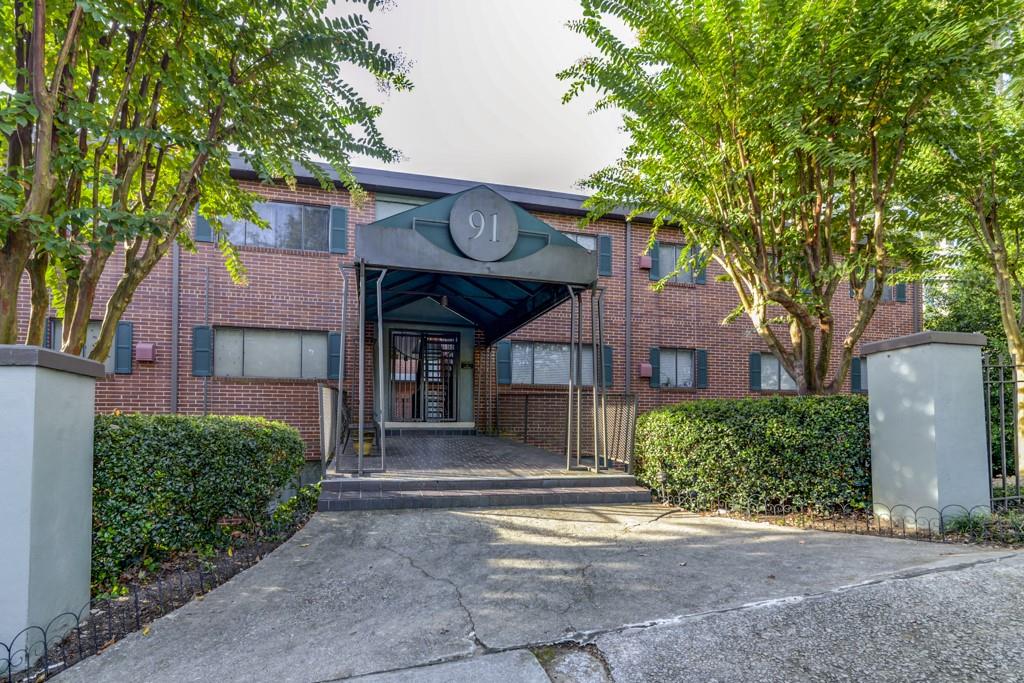 91 Rumson Road Northeast, Unit C35 Atlanta, GA 30305 - Photo 1 of 12 a view of a house with a outdoor space