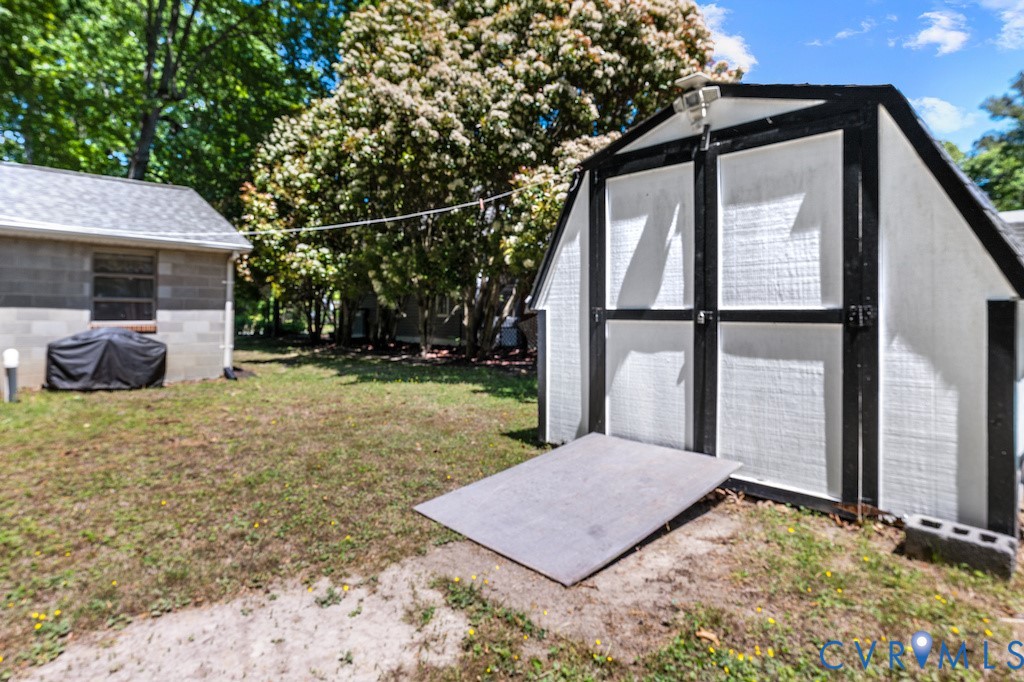 214 Davis Drive Reedville, VA 22539 - Photo 13 of 22 a view of a house with backyard and sitting area