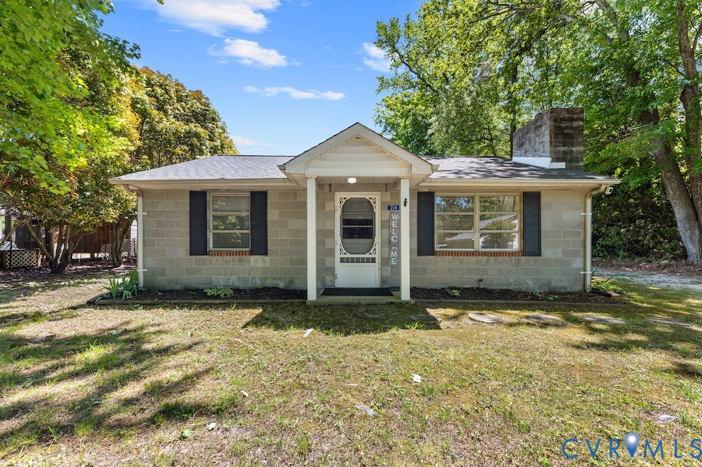 214 Davis Drive Reedville, VA 22539 - Photo 2 of 22 a front view of a house with a yard