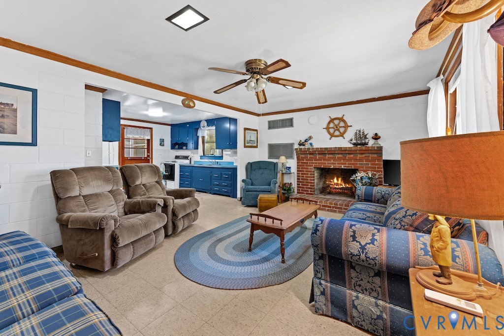 214 Davis Drive Reedville, VA 22539 - Photo 5 of 22 a living room with furniture and a fireplace