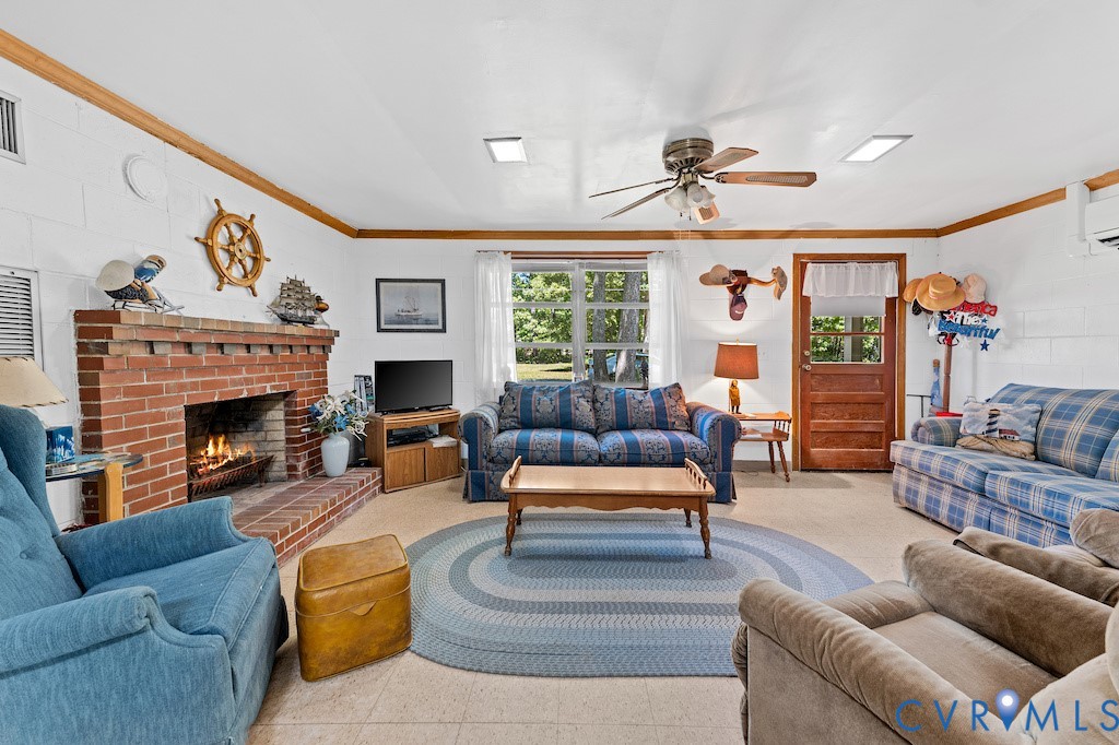 214 Davis Drive Reedville, VA 22539 - Photo 7 of 22 a living room with furniture fireplace and window