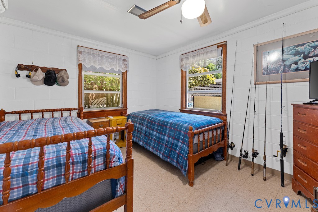 214 Davis Drive Reedville, VA 22539 - Photo 10 of 22 a bedroom with a bed and a window