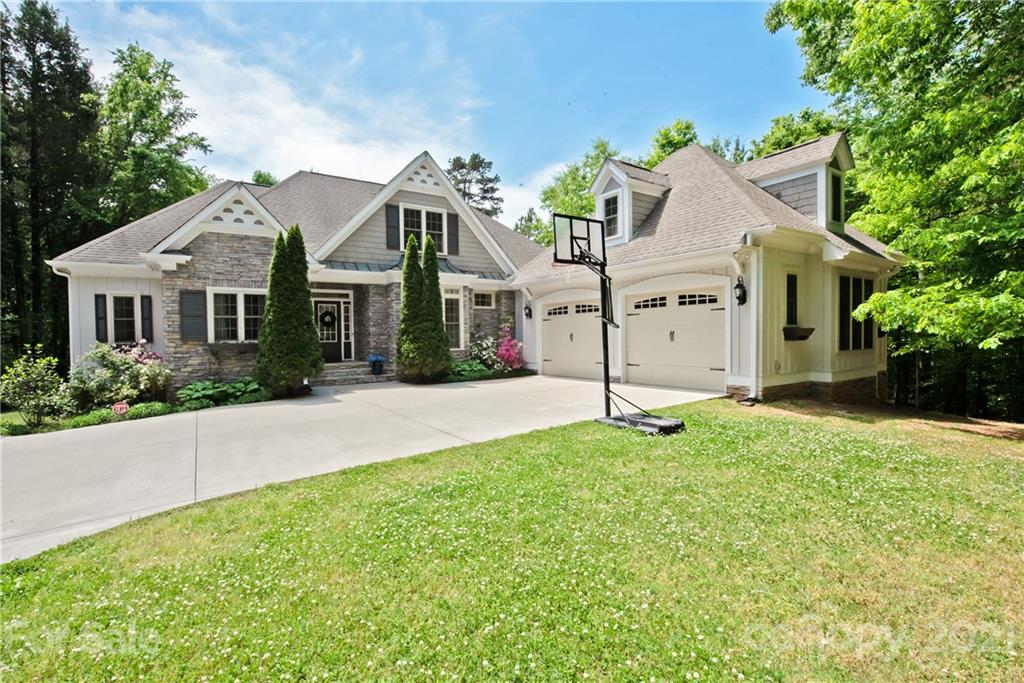 145 Huntington Ridge Place Mooresville, NC 28115 - Photo 2 of 45 a front view of a house with a yard and garage