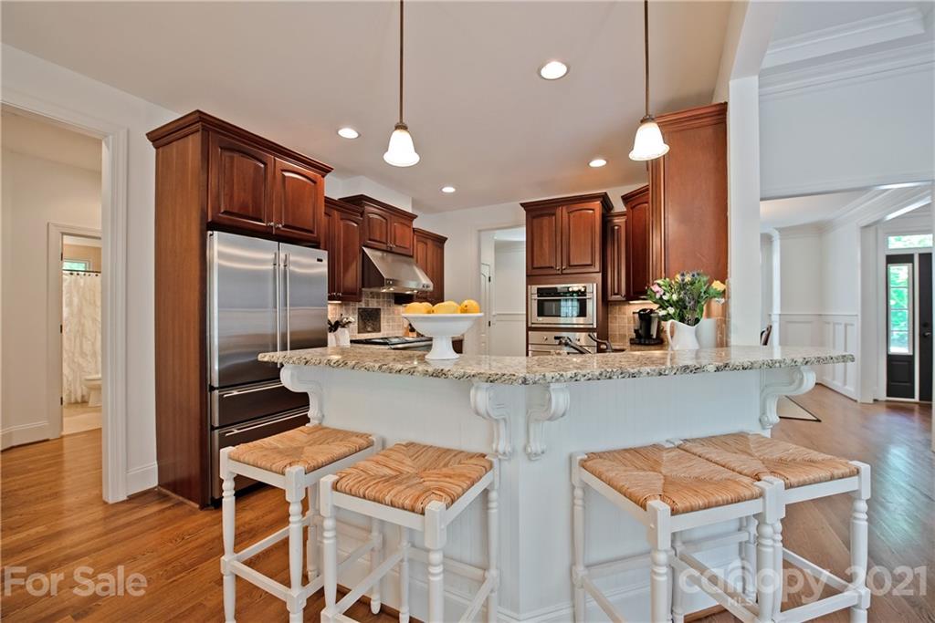145 Huntington Ridge Place Mooresville, NC 28115 - Photo 14 of 45 a kitchen with cabinets and chairs
