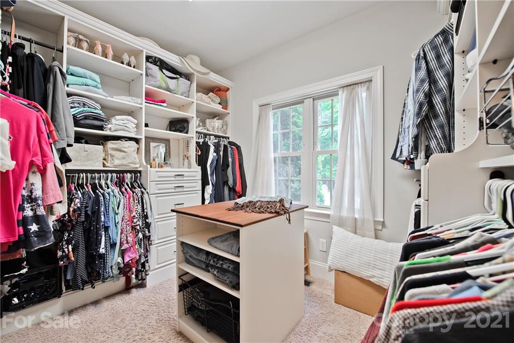 145 Huntington Ridge Place Mooresville, NC 28115 - Photo 27 of 45 a view of walk in closet with clothes and shoes