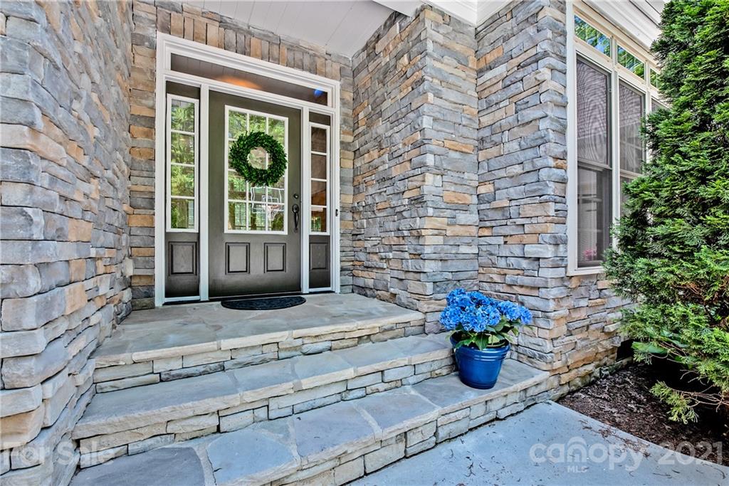 145 Huntington Ridge Place Mooresville, NC 28115 - Photo 4 of 45 a view of a brick house with potted plants