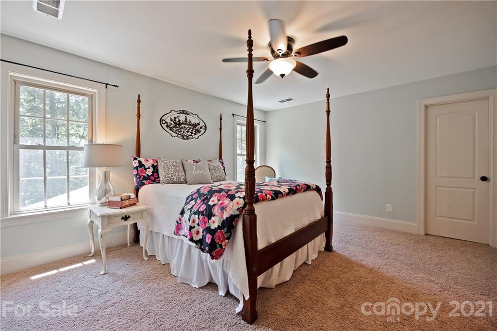 145 Huntington Ridge Place Mooresville, NC 28115 - Photo 31 of 45 a bed room with a bed and a window