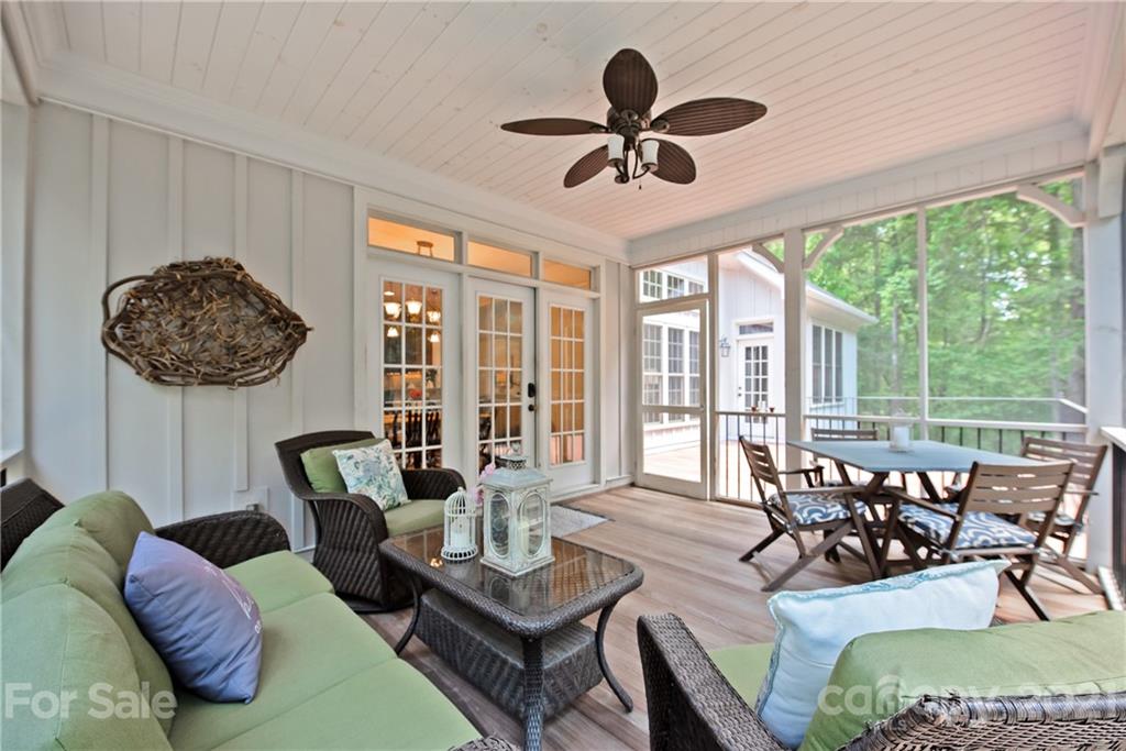 145 Huntington Ridge Place Mooresville, NC 28115 - Photo 39 of 45 a living room with furniture a ceiling fan and a large window