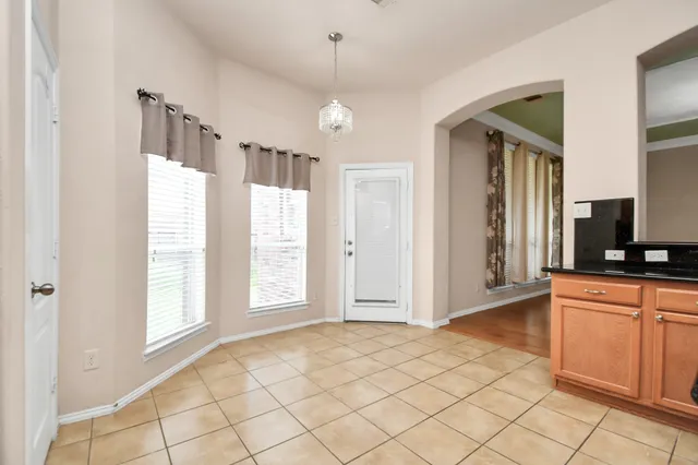 a view of a kitchen with a sink and a window