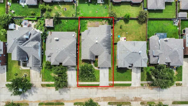 aerial view of a house with a garden and plants