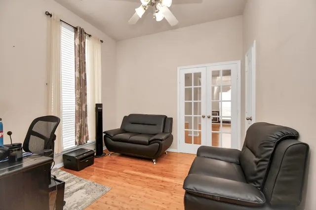 a living room with furniture and a large window