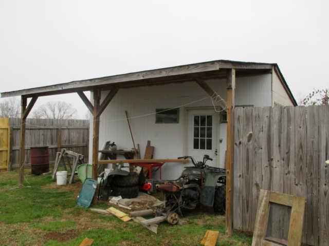 995 Rose Hill Road Pulaski, TN 38478 - Photo 19 of 20 a backyard of a house with barbeque oven and outdoor seating