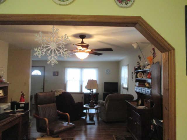 995 Rose Hill Road Pulaski, TN 38478 - Photo 20 of 20 a living room with furniture and a chandelier